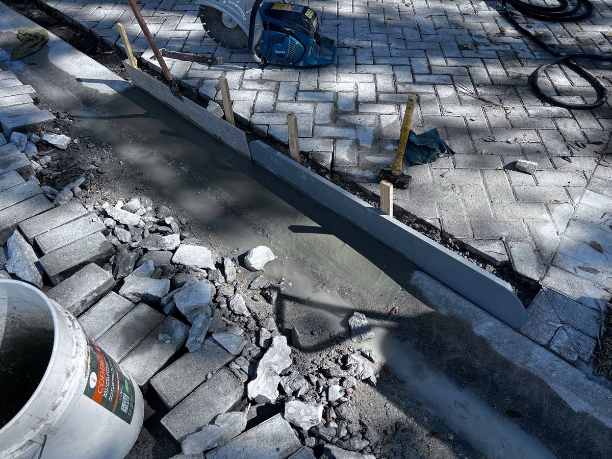 Concrete border repair: paver repair & re-leveling by Paver Savers & Concrete