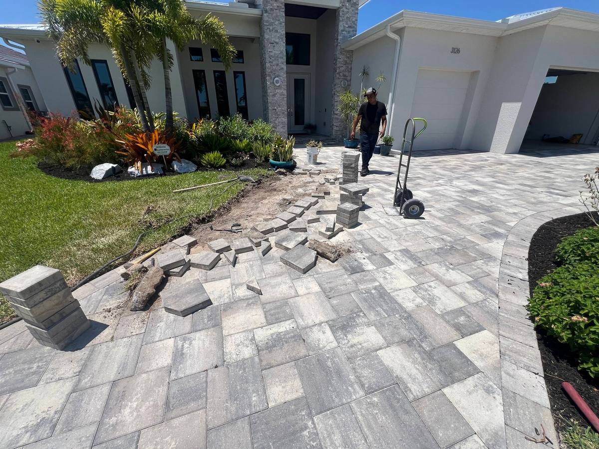 Paver Savers installing new grey pavers at the front entry of a Southwest Florida home
