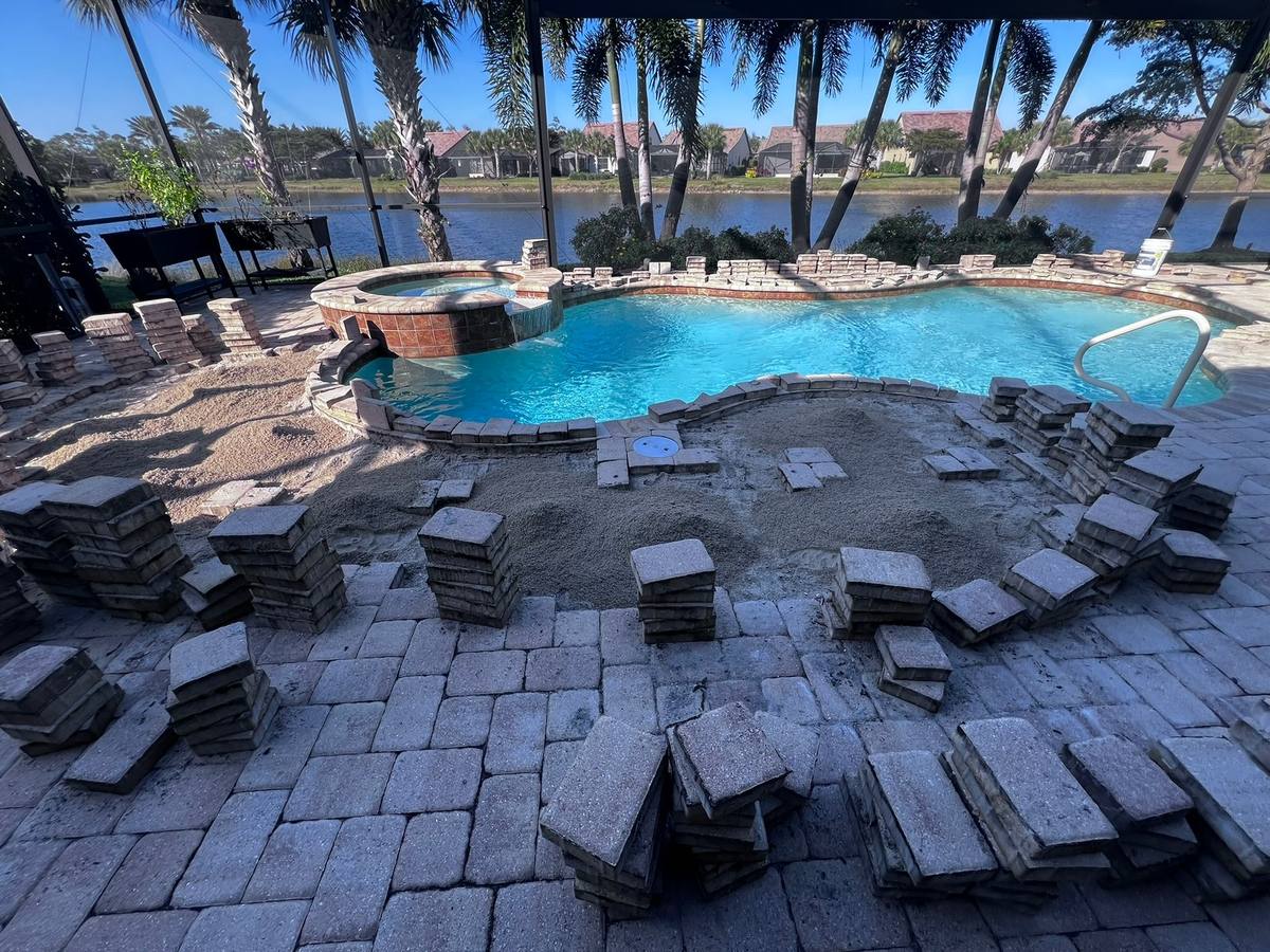 Pool deck re-level in progress: paver repair & re-leveling by Paver Savers & Concrete