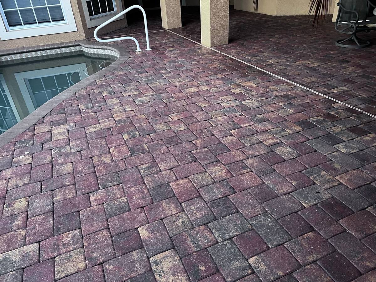 Sealed red and charcoal paver lanai at a Palmira home in Bonita Springs