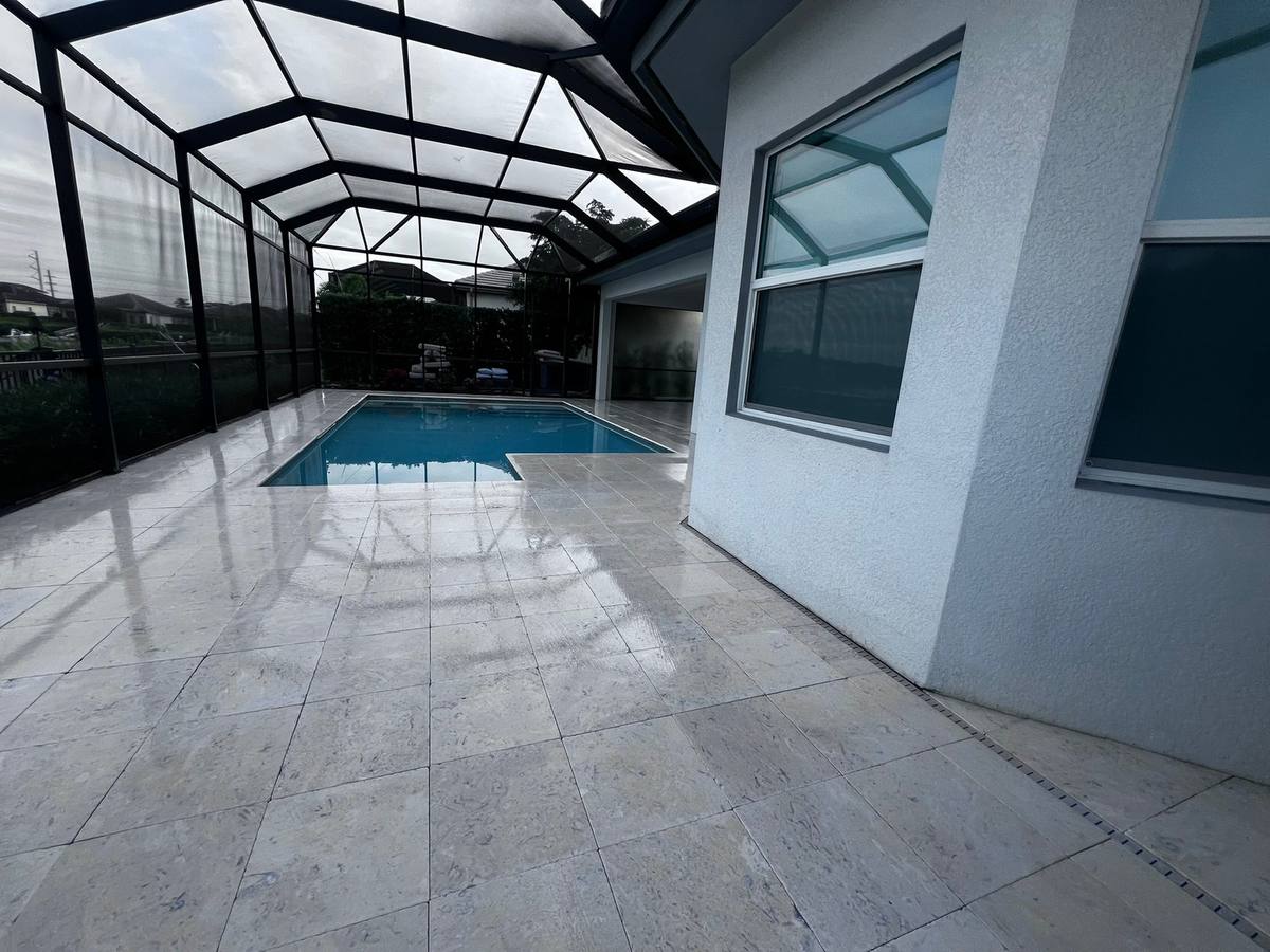 Shellstone lanai cleaned: travertine & natural stone care by Paver Savers & Concrete